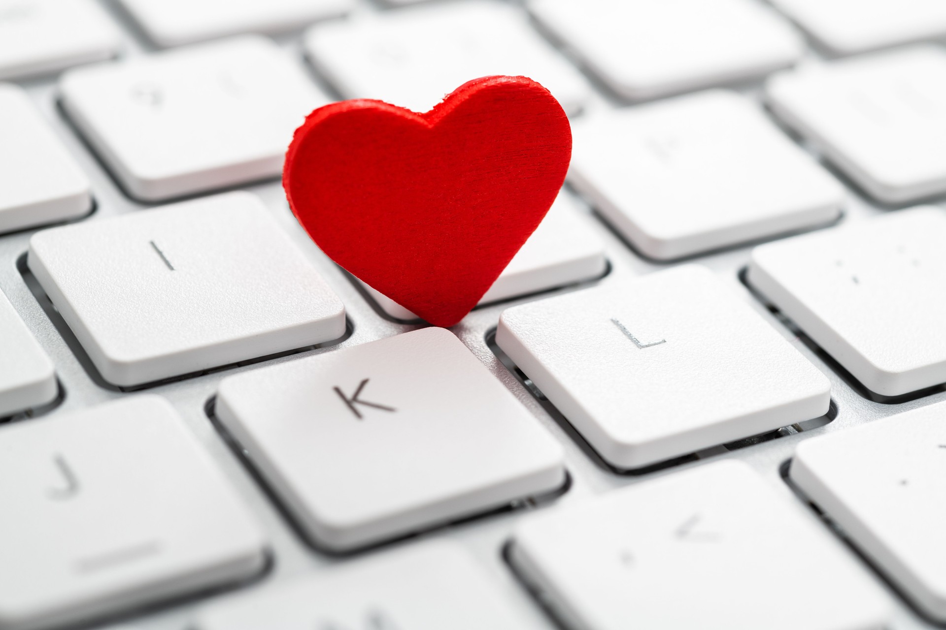 Small red heart on the computer keyboard